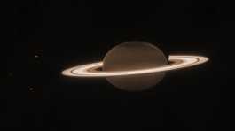 the planet Saturn and three of its moons