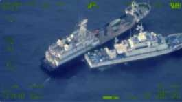 Chinese militia vessel and Philippine coast guard vessel