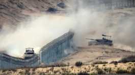 Israeli tanks at the border fence