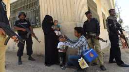 police protect polio team