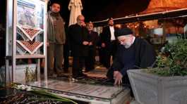 Ebrahim Raisi visits the grave of Iranian military commander General Qassem Soleimani