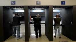 Gun owners fire their pistols