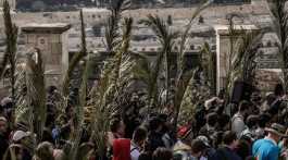 Christians holding palm leaves in Jerusalem